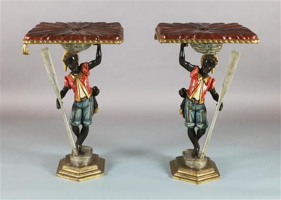 A pair of late 19th century Florentine carved and painted wood blackamoor occasional tables, W.1ft 8in. D.1ft 8in. H.2ft 8in.